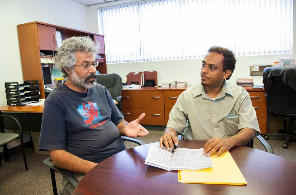 An IRC Employment Coordinator advising a newly arrived refugee about employment in the U.S. IRC/LAnderson