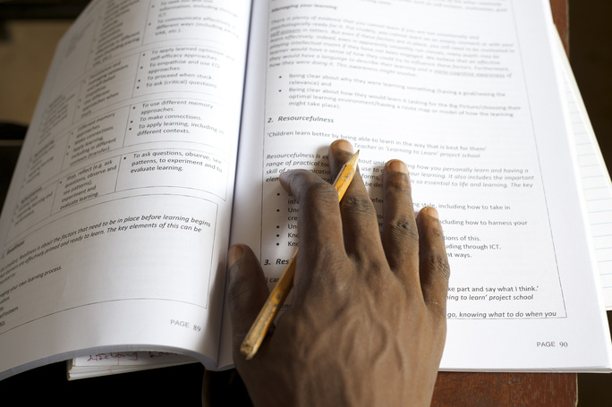 A refugee student working on a distance learning program in Sierra Leone. IRC/Aubrey Wade