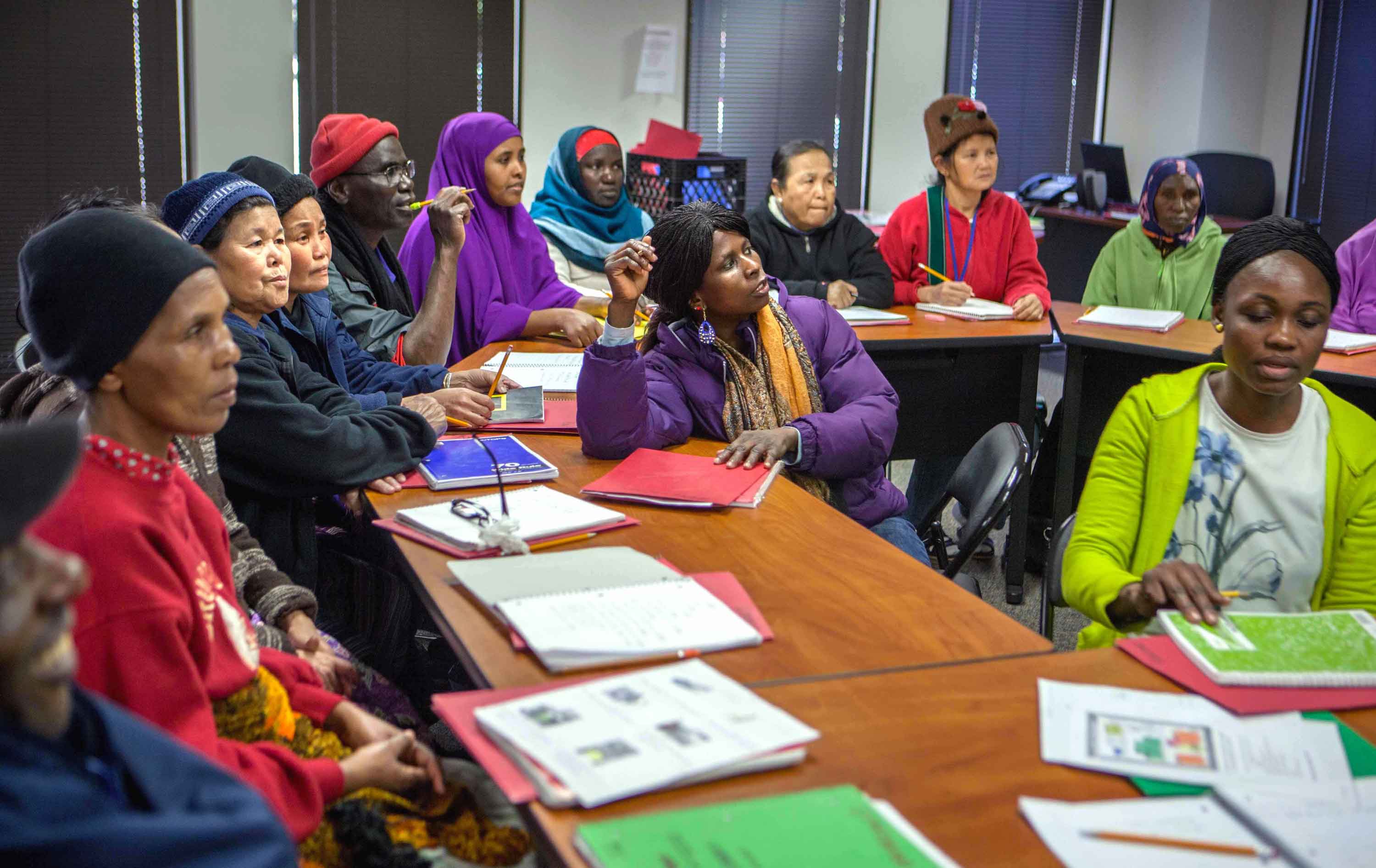 Refugees learning in a cultural orientation class