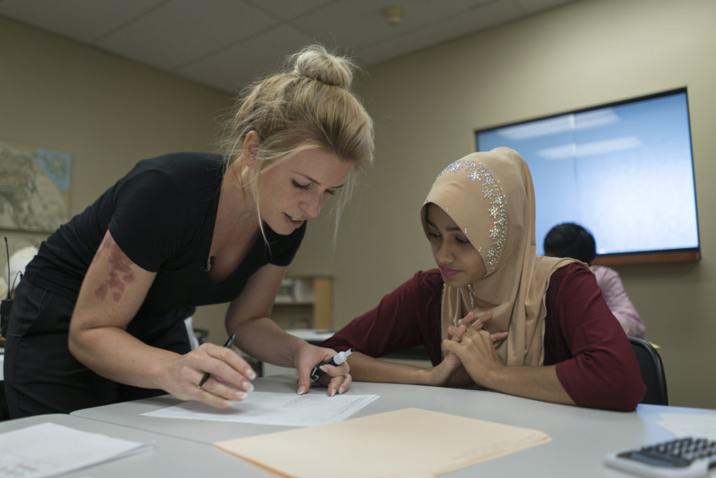 A Burmese refugee attending a financial literacy class taught by a cultural orientation provider. IRC/Andrew Oberstadt