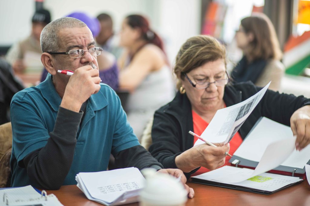 Students participating in an ESL class at their local resettlement office