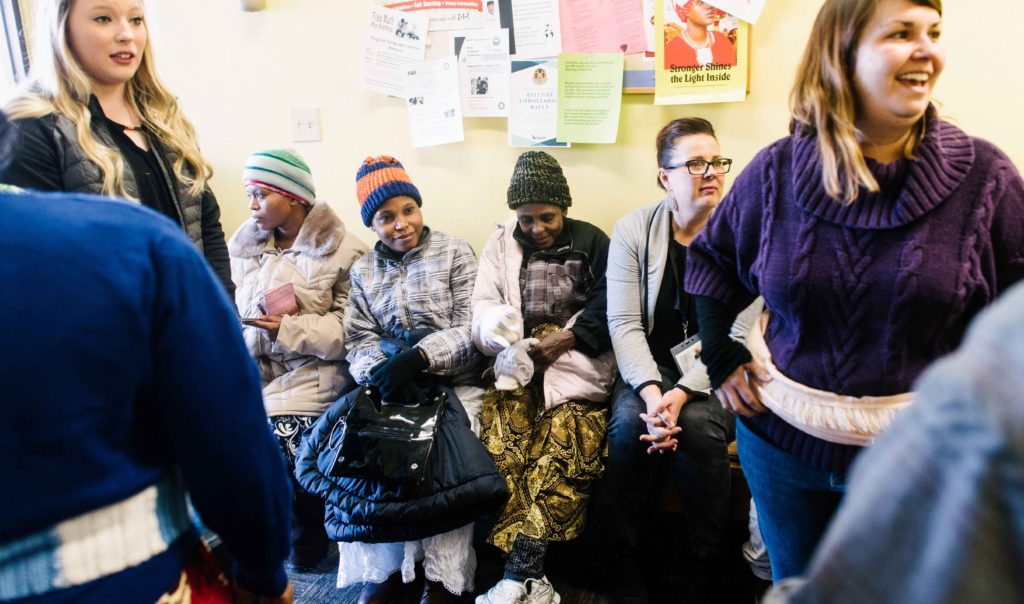 A group of refugees participating in programs at their local resettlement office. IRC/Jonathan McBride
