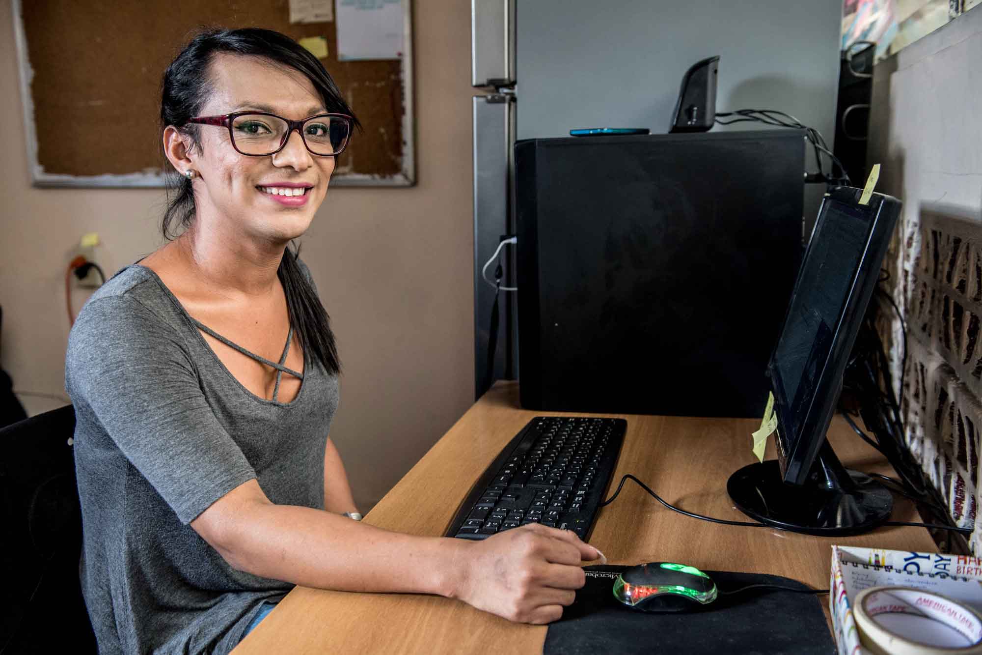 A refugee resettlement staff worker at her office in El Salvador