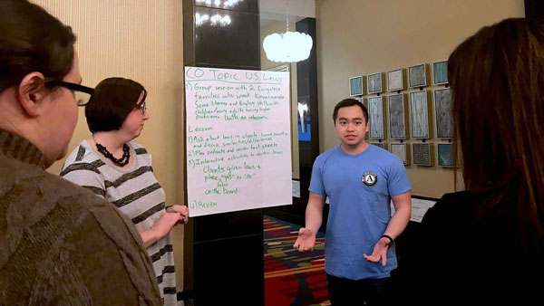A cultural orientation provider leading a discussion on U.S. laws