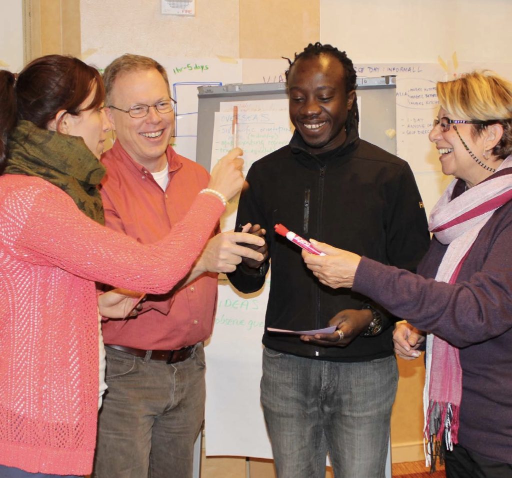 A group of cultural orientation providers collaborating together during a CORE workshop
