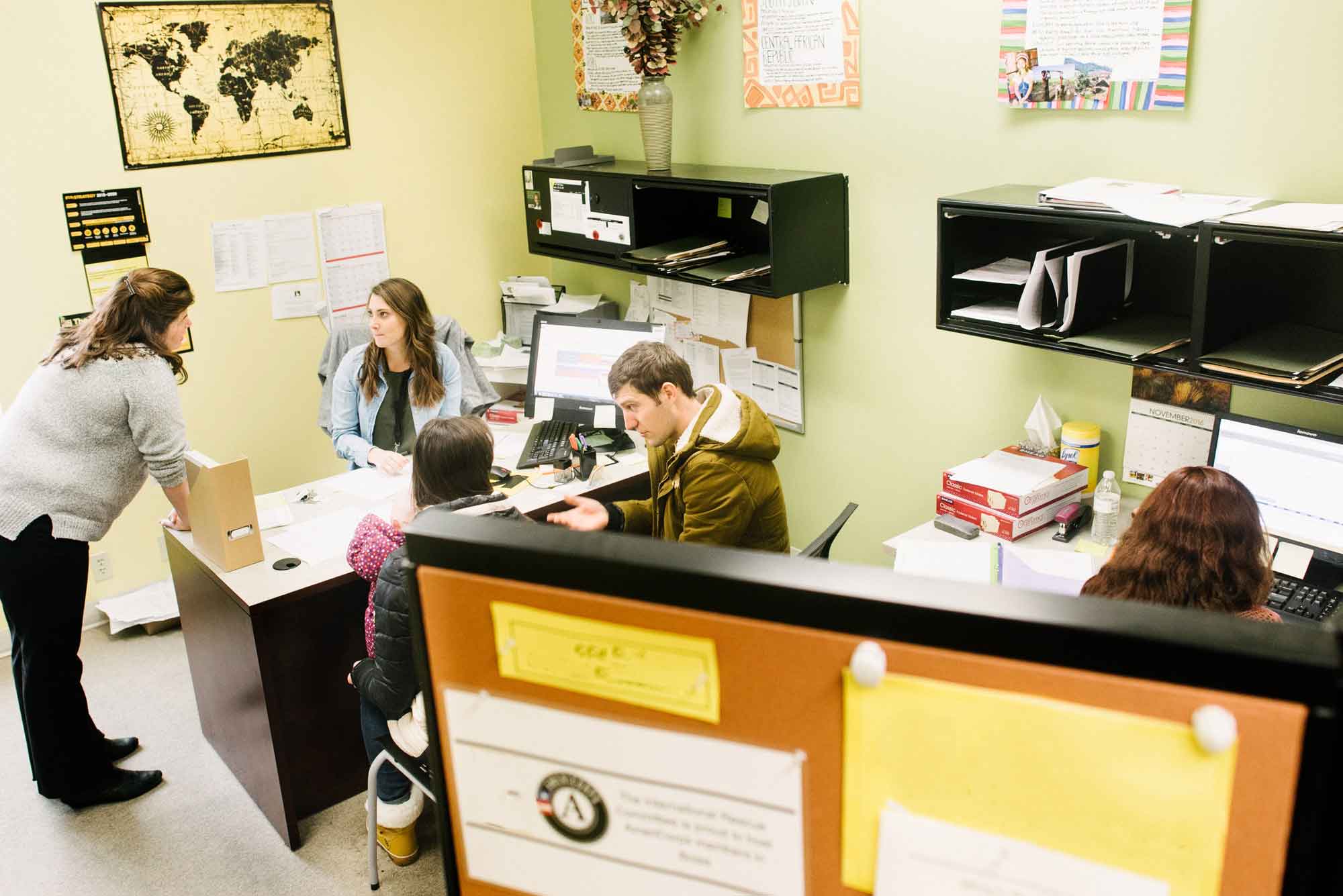 A refugee resettlement staff member talking with a client. IRC/JMcbride